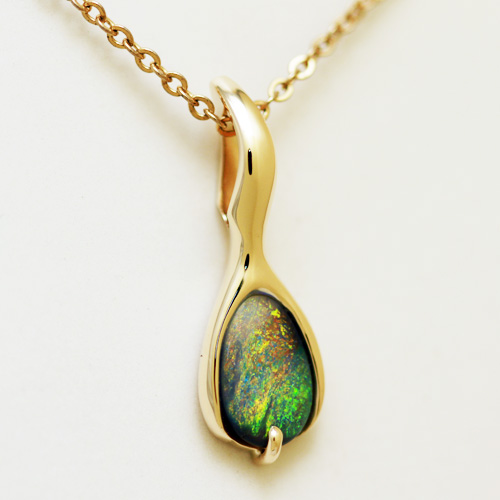 14k Yellow Gold Pendant with a SOLID BLACK OPAL Golden fire always. Very bright and rich colour